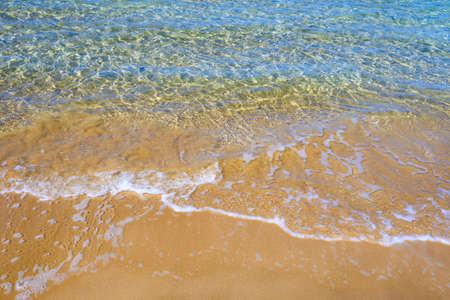 Texture of golden sand and emerald water. Santa Maria beach. Paros Island, Cyclades, Greeceの写真素材