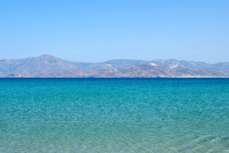 Santa Maria beach with emerald waters and view on the island of Naxos. The best beach of Paros....