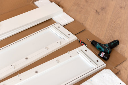 Furniture for self-assembly. The process of installation a furniture in new homeの写真素材