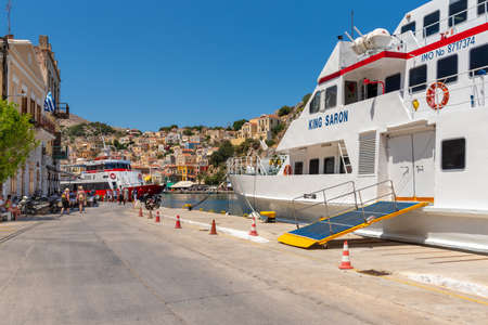SYMI, GREECE - May 15, 2018: The main road in the port of Symi island.のeditorial素材