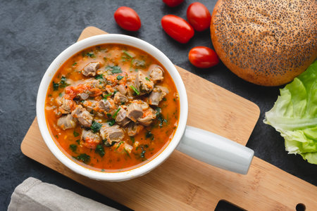 Chicken stomachs stewed in tomato sauce with vegetables
