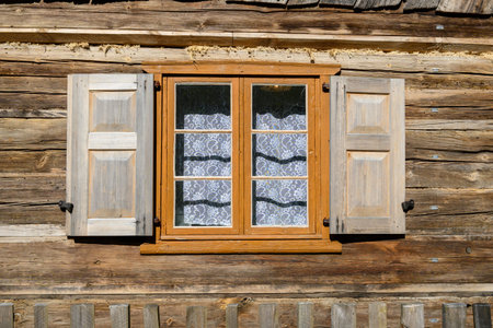 Wdzydze Kiszewskie, Poland - May 15, 2022: A window in old wooden cottage. Kashubian Ethnographic...