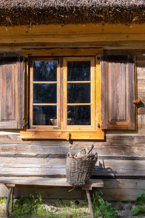 Wdzydze Kiszewskie, Poland - May 15, 2022: A window in old wooden cottage. Kashubian Ethnographic Park in Wdzydze Kiszewskie. Polandのeditorial素材