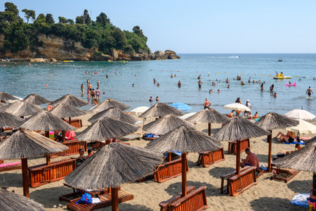 Ulcinj, Montenegro - June 4, 2022: Tourists on the municipal beach in Ulcinj. Ulcinj is the southernmost city at Montenegrin coast.のeditorial素材