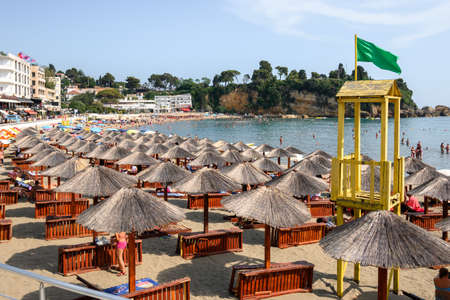 Ulcinj, Montenegro - June 4, 2022: Umbrellas and deck chairs on the beach in Ulcinj. Ulcinj is the southernmost city at Montenegrin coast.のeditorial素材