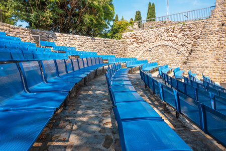 Stari Bar, Montenegro - June 5, 2022: Blue chairs in the amphitheater. Stari Bar fortress in Montenegro. Europeのeditorial素材