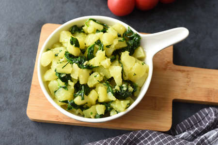 Boiled potatoes with spinach, garlic, and olive oilの写真素材