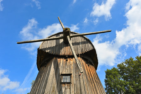 Lublin, Poland - September 13, 2022: Wooden windmill in the Lublin Open Air Village Museum