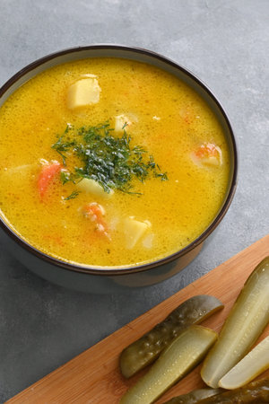 Cucumber soup - traditional Polish soup with pickled cucumbers, potatoes, carrots and dillの写真素材