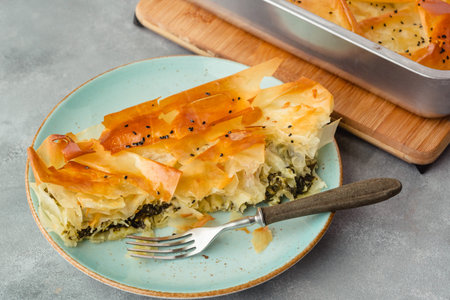 Spinach and feta pie in filo pastry. Crispy spinach feta cheese phyllo pastry pie