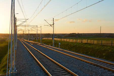 Railroad track during spring evening in the countrysideの写真素材