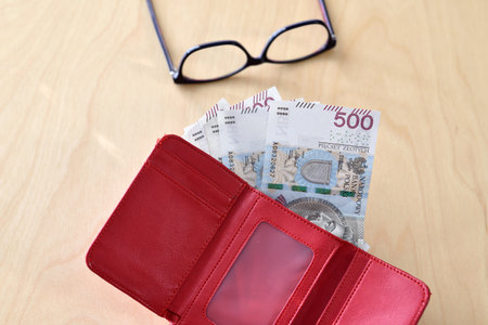 Wallet with polish currency money. Concept of financial security in old age during retirementの写真素材