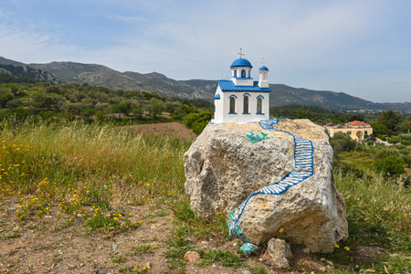 Small white blue church on a rock near village of Zia on the island Kos in Greeceの写真素材