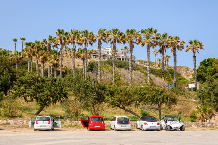Kos, Greece - May 12, 2024: Cars parked next to the Paradise Beach on the island of Kos. Greeceのeditorial素材