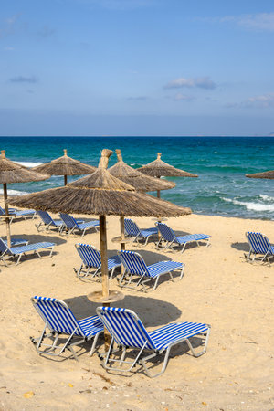 Sunbeds with umbrella on sandy beach of Marmari. The Greek island of Kosの写真素材