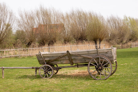 Mokry Dwor, Poland - April 7, 2024: Old wooden cart in educational farm in Mokry Dwor village....
