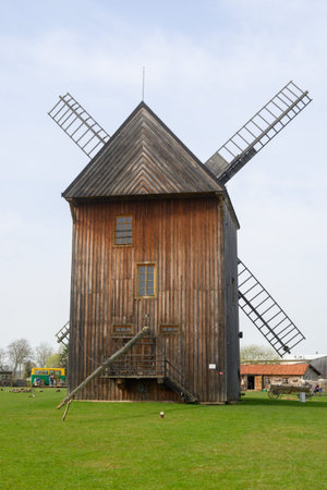 Mokry Dwor, Poland - April 7, 2024: Traditional wooden paltrak windmill in Mokry Dwor village....