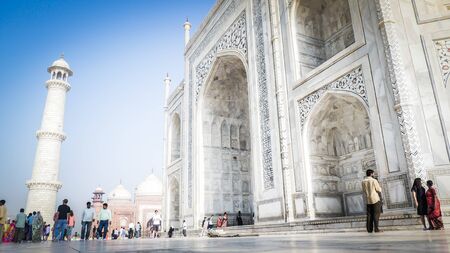 Agra / India - April 14 2017: Taj Mahal front facade close up view with a minaret and mosque inside Taj Mahal complex in Agra, India.のeditorial素材