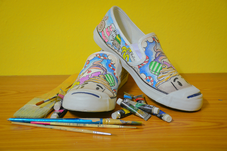 Shoe with Acrylic paint brushの写真素材