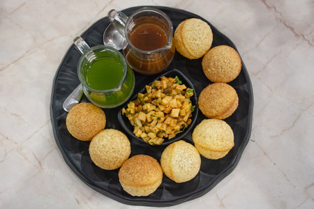 This picture is Indian food made in Thailand. It is served with two colors of sour sauce.の写真素材