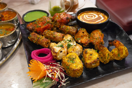 Indian food made in Thailand There will be meat such as fish, shrimp, chicken, goat and curry served together.の写真素材