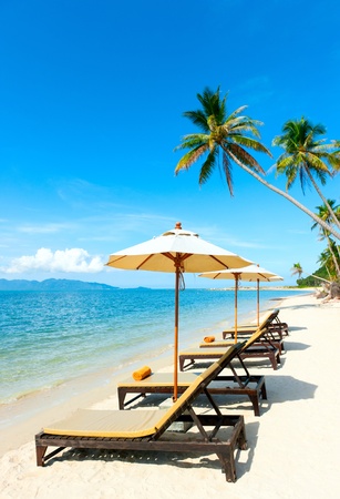 Chairs with umbrella on the beach near with sea