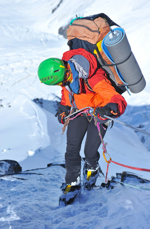 Climber abseiling from the mountainの写真素材