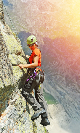 Extreme sport. The rock-climber during rock conquestの写真素材