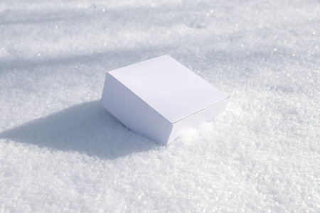 craft white square boxes on snow. High quality photoの写真素材