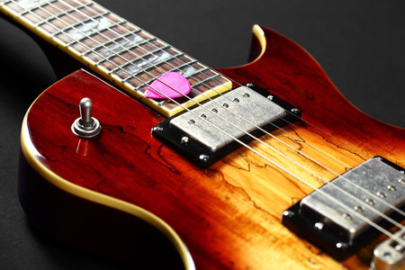 Six-string electric guitar closeup 