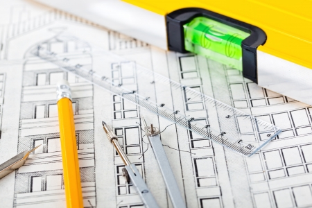 Architectural plans of the old paper tracing paper measuring tools and file with the projectの写真素材