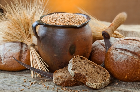 fresh bread and wheat on the woodenの写真素材
