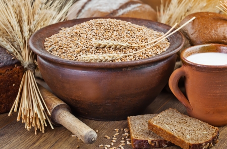 fresh bread and wheat on the woodenの写真素材