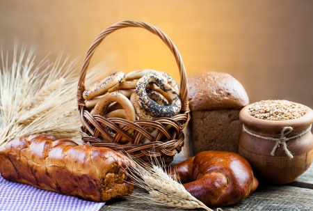 fresh bread and wheat on the woodenの写真素材