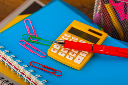 Back to school blackboard with pencilbox and school equipment on tableの写真素材