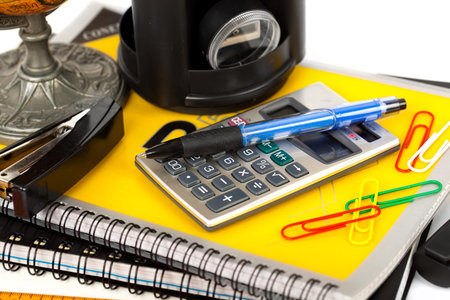 Back to school blackboard with pencilbox and school equipment on table