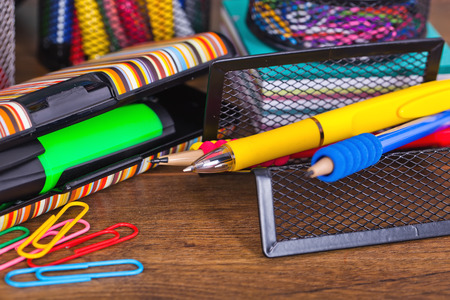 Back to school blackboard with pencilbox and school equipment on tableの写真素材