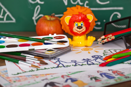 Back to school blackboard with pencilbox and school equipment on tableの写真素材