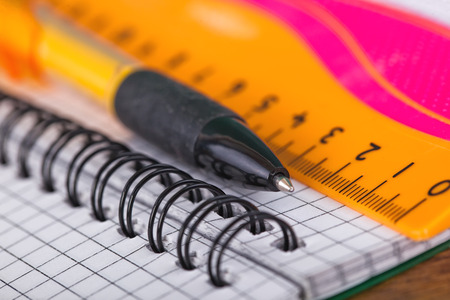 Back to school blackboard with pencilbox and school equipment on tableの写真素材