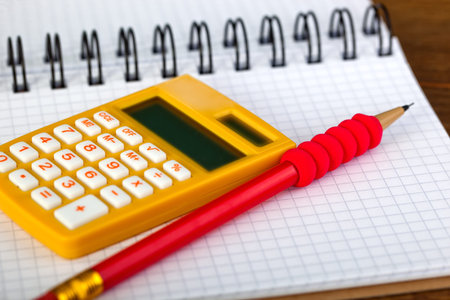 Back to school blackboard with pencilbox and school equipment on tableの写真素材