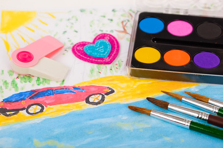 Back to school blackboard with pencilbox and school equipment on tableの写真素材