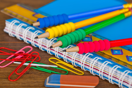 Back to school blackboard with pencilbox and school equipment on tableの写真素材