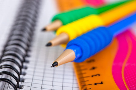 Back to school blackboard with pencilbox and school equipment on table