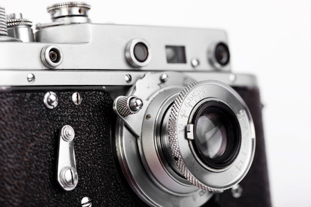 Old photo camera on white background, on the table, closeupの写真素材