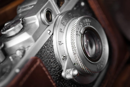 Old camera on an old background on a close-up tableの写真素材
