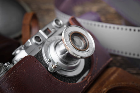 Old camera on a desk on an old background, closeup
