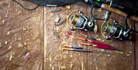 Fishing accessories in the composition on the table