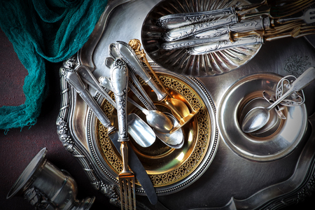 Old silver dishes with accessories for the kitchenの写真素材