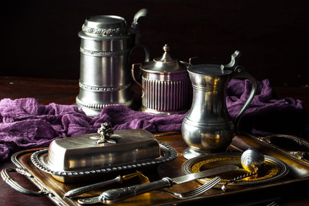 Old silver dishes with accessories for the kitchenの写真素材