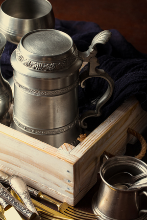 Light foam beer in a glass on an old backgroundの写真素材